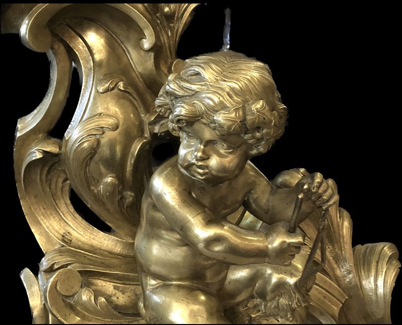 MATCHED PAIR OF FRENCH LOUIS XVI BRONZE ANDIRONS IN THE FORM OF PUTTI