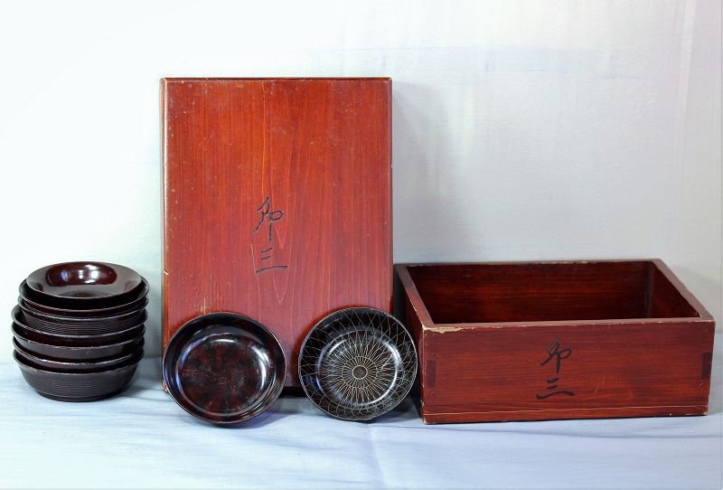 Nine(9) Japanese brown Lacquer on wood sake dishes in wooden box