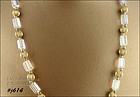 GLASS BEAD NECKLACE WITH ROUND GOLD COLOR SPACERS