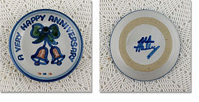 A VERY HAPPY ANNIVERSARY PLATE BY M.A. HADLEY LOUISVILLE STONEWARE