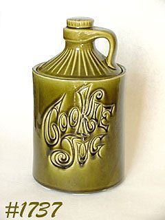 McCOY POTTERY -- NEW DESIGN COOKIE JUG IN OLIVE GREEN COLOR