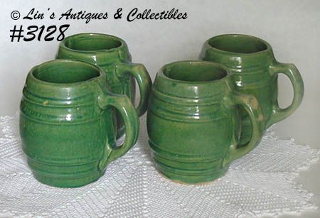 McCOY POTTERY -- GREEN STONEWARE MUGS (4)