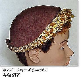 BROWN HAT WITH ATTACHED LEAVES AND BERRIES