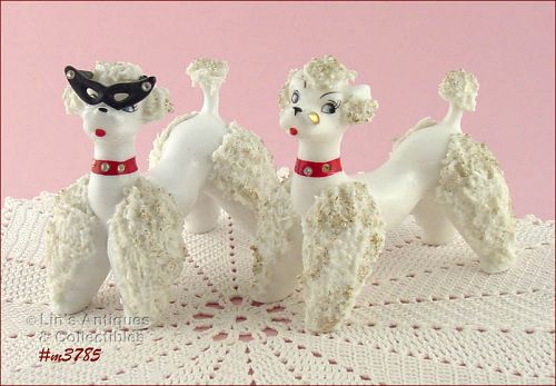 PAIR OF WHITE SPAGHETTI POODLE FIGURINES