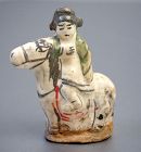 A Porcelain Toy Figure Riding on Horse