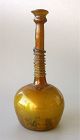 A Fine Islamic Amber Glass Bottle, 9th-13th Century.
