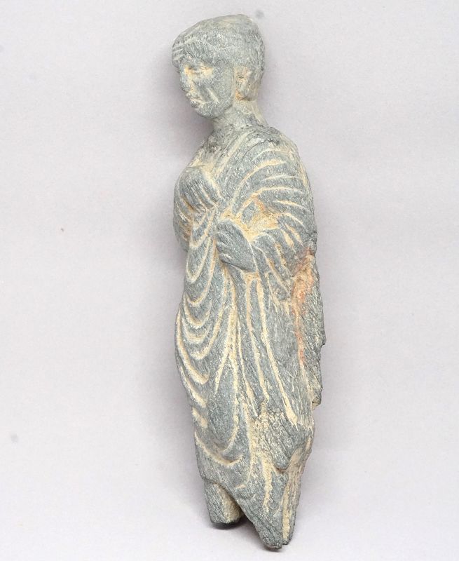 A Gandhara Carved Stone Figure of a Donor or Lay Follower