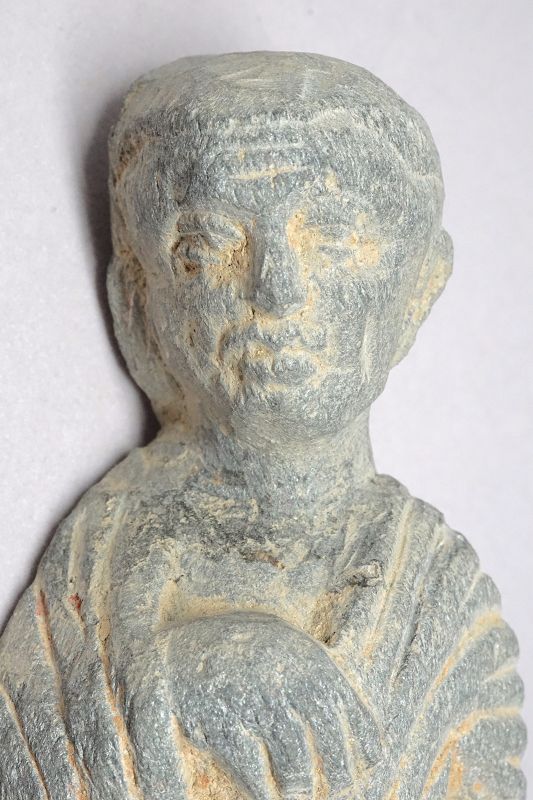 A Gandhara Carved Stone Figure of a Donor or Lay Follower