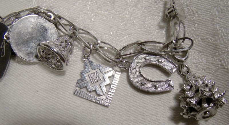 Oval Fold Over Link Sterling Silver Charm Bracelet with 12 Charms 1970