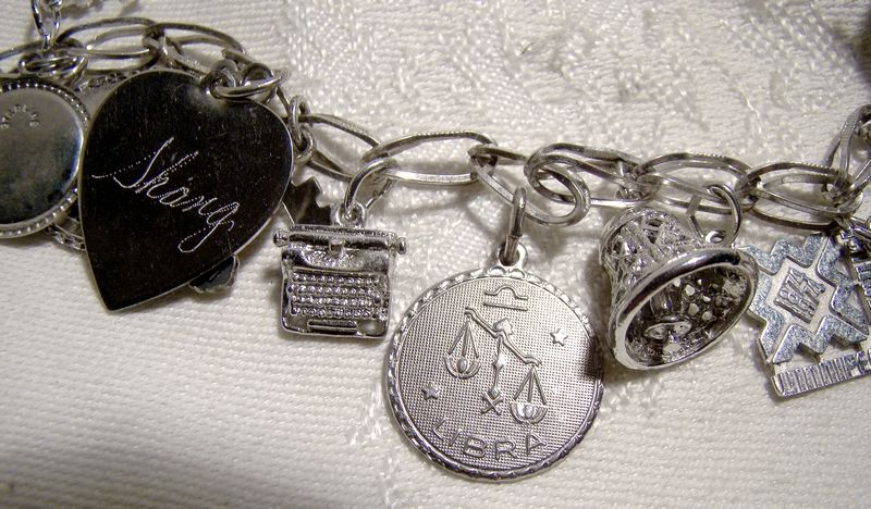 Oval Fold Over Link Sterling Silver Charm Bracelet with 12 Charms 1970