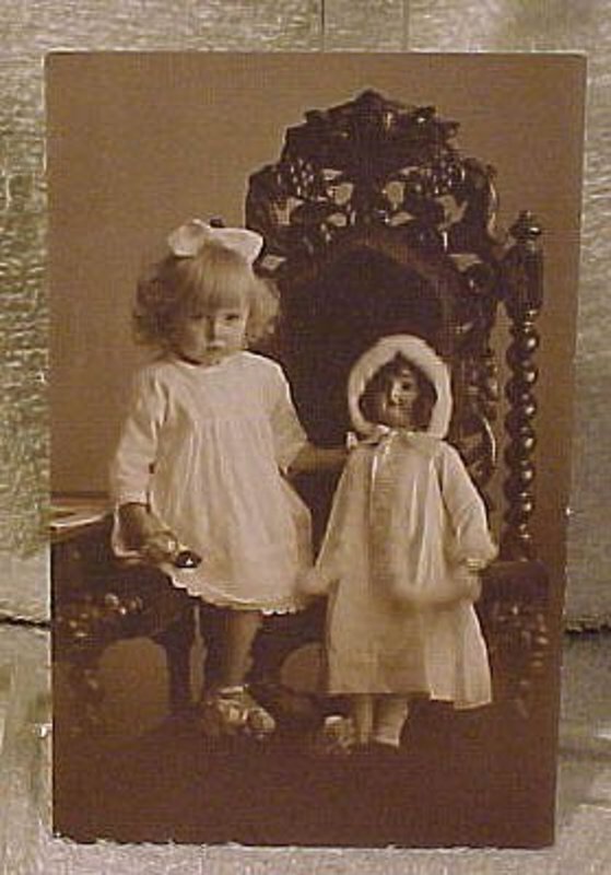 Cute YOUNG GIRL WITH DOLL PHOTO POSTCARD c1910