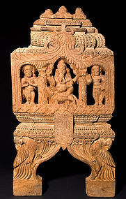 Indian wooden temple carving with Ganesh and Shiva