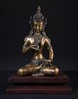 Tibetan Bronze Buddha Vajrasattva on wooden pedestal.