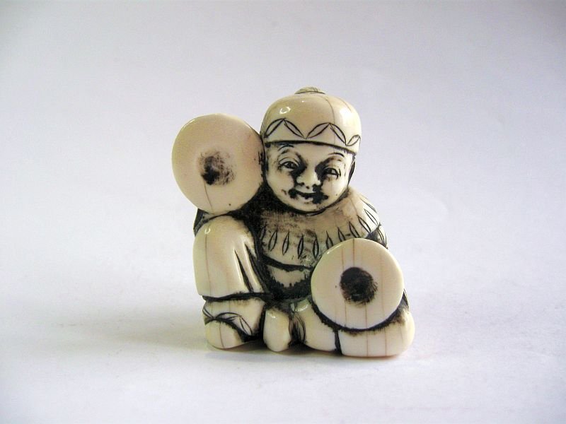 Japanese Netsuke of a Child with Cymbals; Signed