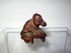 Japanese Wood Netsuke of a Reader by Ikko, Signed