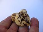 Japanese Netsuke of a Resting Peasant with a Basket