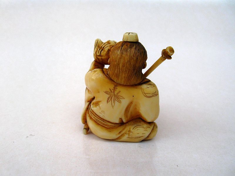 Japanese Carved Okimono of a Conch Horn Player, Signed Gyokumin