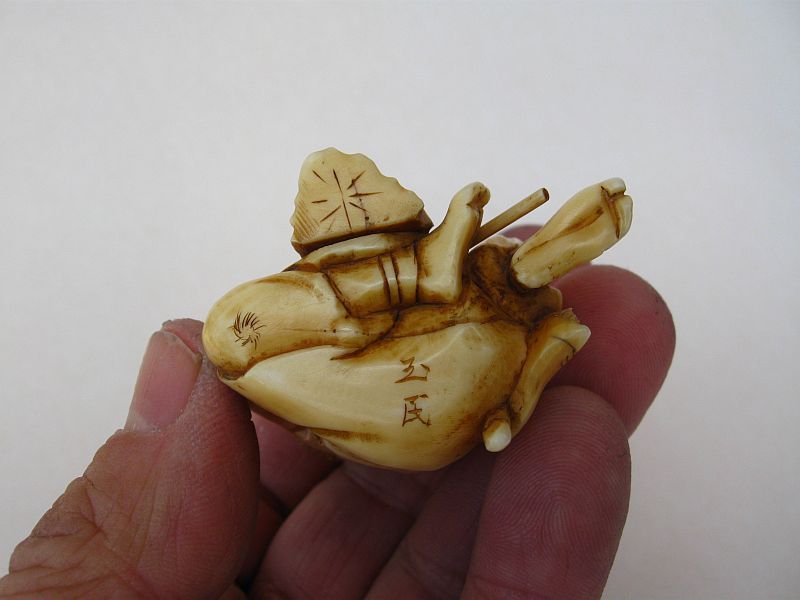 Japanese Carved Okimono of a Conch Horn Player, Signed Gyokumin
