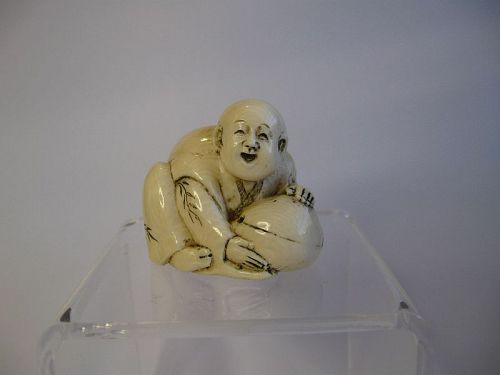 Japanese Carved Netsuke of a Boy with a Peach, Signed