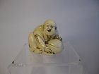 Japanese Carved Netsuke of a Boy with a Peach, Signed