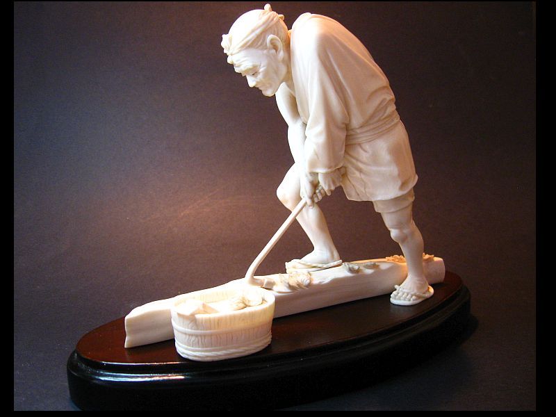 Japanese Carved Okimono of a Woodworker Using a Chouna, Signed