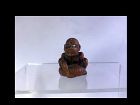 Japanese Wooden Netsuke of a Rock Lifter, Signed Gyokkei