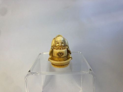 Japanese Netsuke of a Man Sharpening a Tool, Signed Masakazu