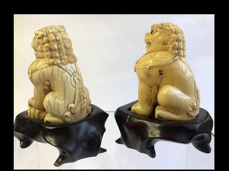Chinese Pair of Carved Foo Dogs on Wooden Stands