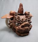 A karashishi wood mask, metal eyes (one of a pair)