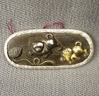 Japanese multi metal plaque with puppies and shell, 19th C