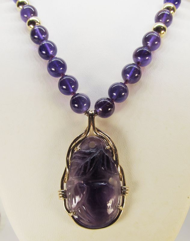 Carved Amethyst and 14Kt Gold Pendant on an Amethyst Necklace