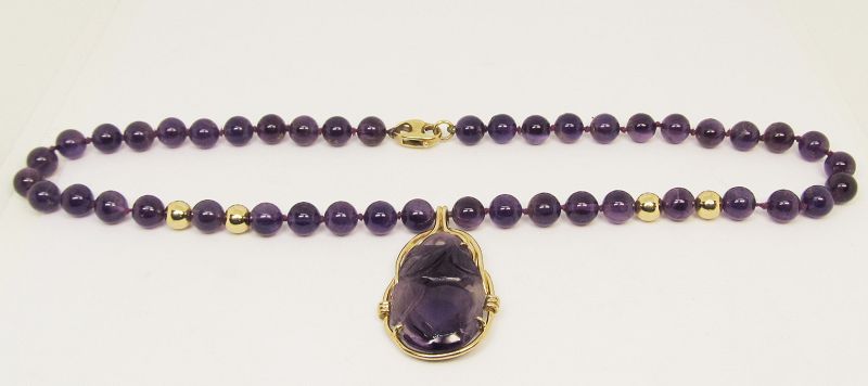 Carved Amethyst and 14Kt Gold Pendant on an Amethyst Necklace