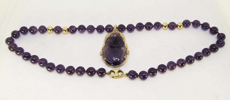 Carved Amethyst and 14Kt Gold Pendant on an Amethyst Necklace