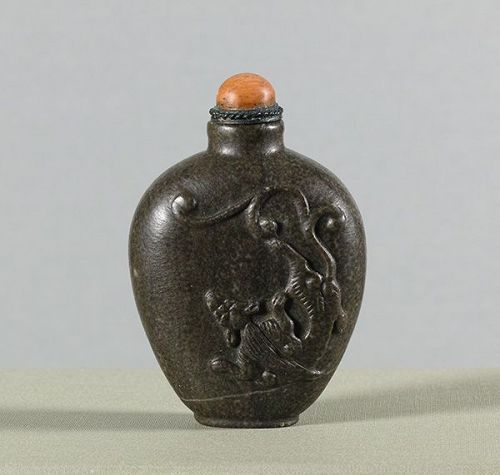 A Chinese Carved Fossiliferous Limestone Chilong Snuff Bottle. 19th C.
