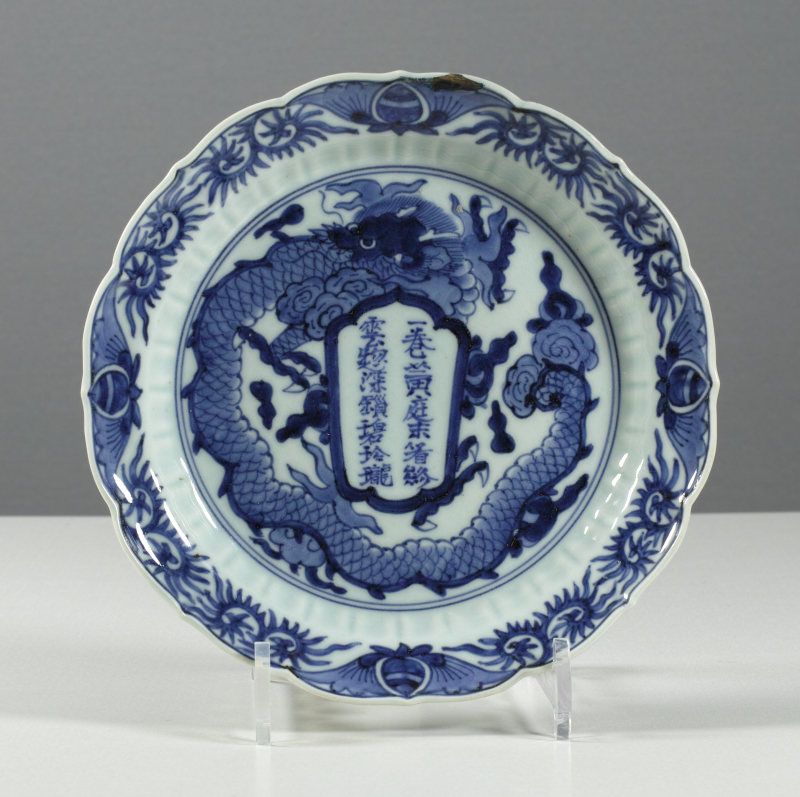 Arita Dragon and Calligraphy dish, circa 1780. Filled chip.