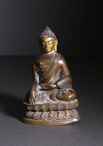 A Tibetan Bronze figure of Shakyamuni, 19th century or earlier
