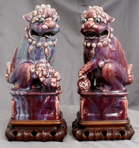 Pair of Chinese Qing Dynasty Red Flambe Glaze Buddhist Lion Dogs