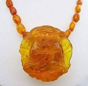 Stunning Copal Bead and Carved Buddha Necklace