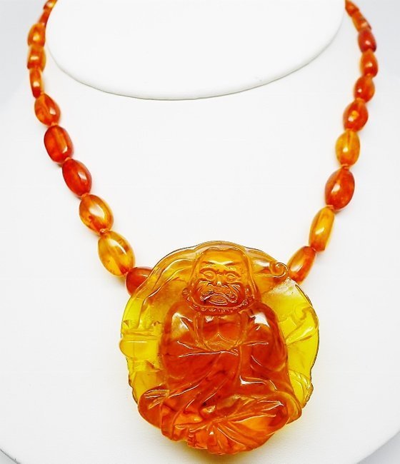 Stunning Copal Bead and Carved Buddha Necklace
