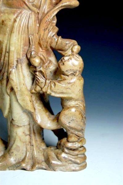 A Soapstone Carving of  A Lady and A Child.