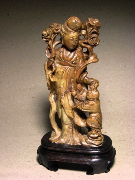 A Soapstone Carving of  A Lady and A Child.