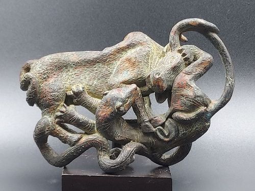 A Bronze Plaque in a Scene of An Ox  Fighting with a Tiger and Snake.