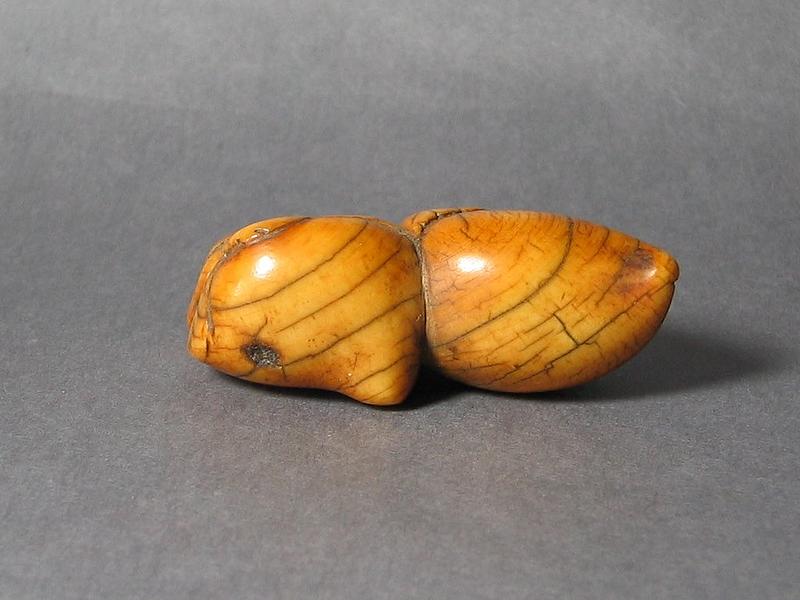 An Ivory Toggle In Shape of A Pair of Peaches