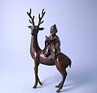 A Fine Bronze Piece of a Sage Riding on a Deer