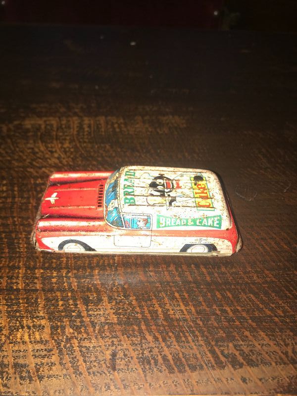 Tin Toy Car with Black Americana Advertising on the Top