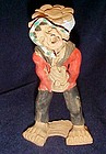 Peruvian clay figure ofman with burden basket souvenir