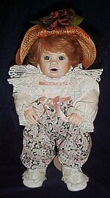 Porcelain doll with "Patches" head dressed nicely