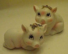 Bisque pigs figurines with enamel butterfly's
