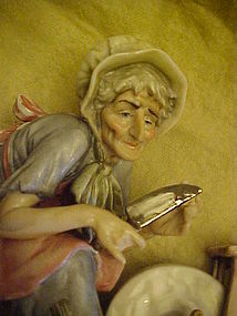 Welsh figurine old woman with knife at grinding wheel