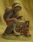 Welsh figurine old woman with knife at grinding wheel